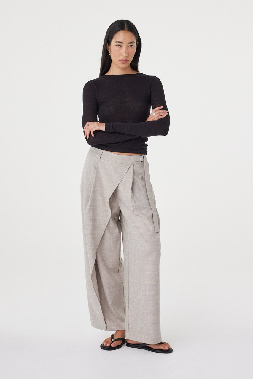 Three-quarter front view of the Calla Pant in Taupe Plaid featuring the metal buckle detail and wide-leg silhouette.