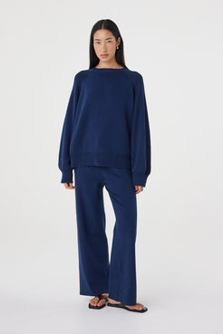 Full-length view of the Milan Pant in Navy & Tumeric styled with the matching Aubrey Sweater for a coordinated knit set.