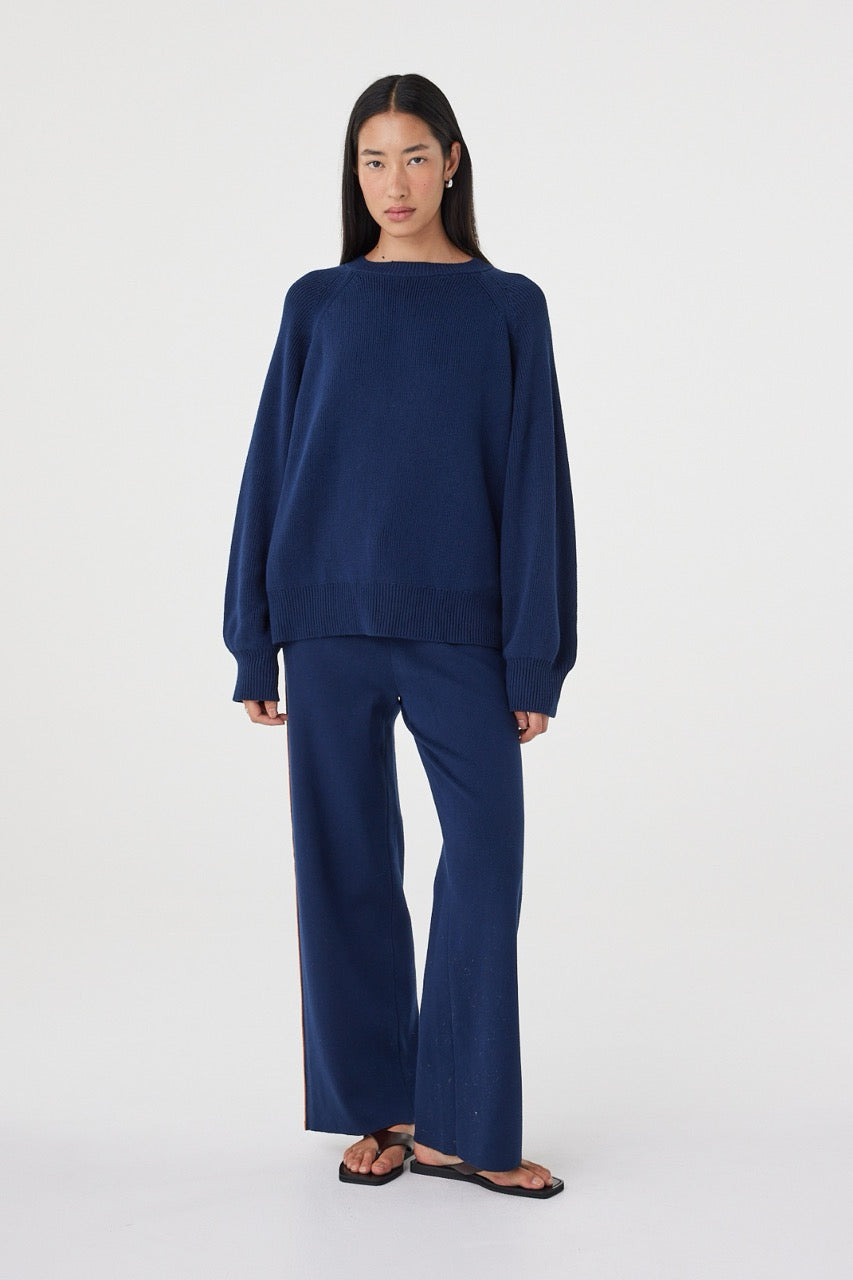Full-length view of the Milan Pant in Navy & Tumeric styled with the matching Aubrey Sweater for a coordinated knit set.