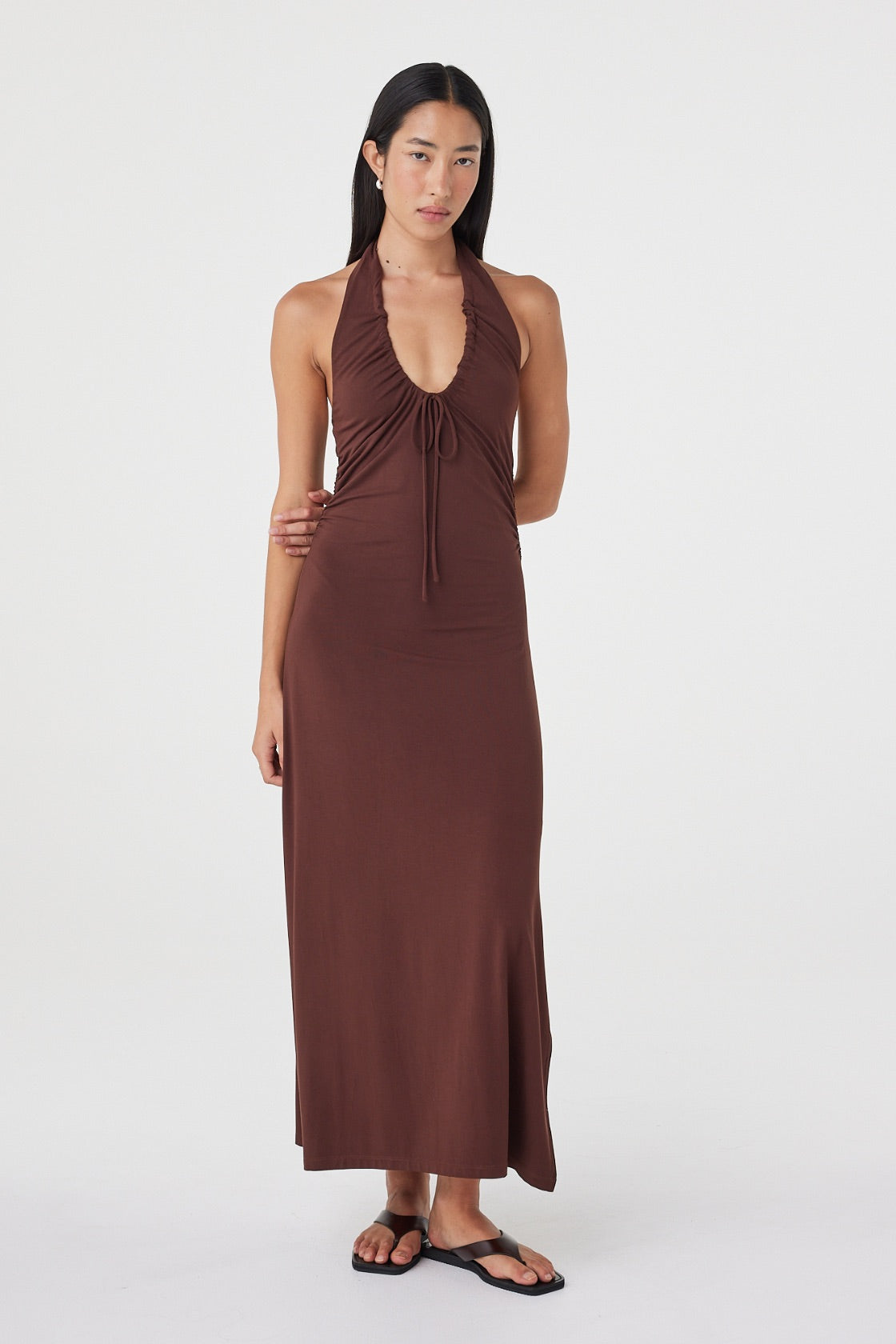 Full-length front view of the Suki Dress in Espresso showcasing the fluid maxi silhouette, halter neckline and side splits.