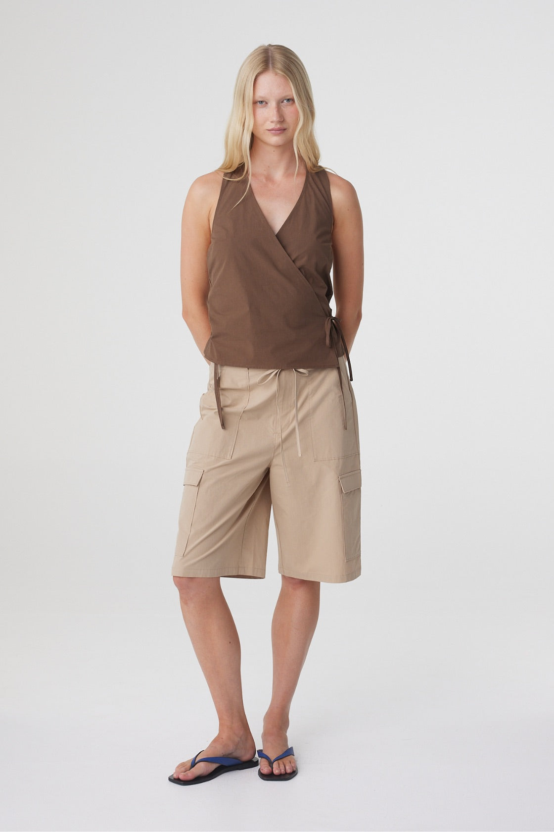 Daria Short in Camel, full length front view styled with the Lilia Wrap Top in Espresso and flat sandals.