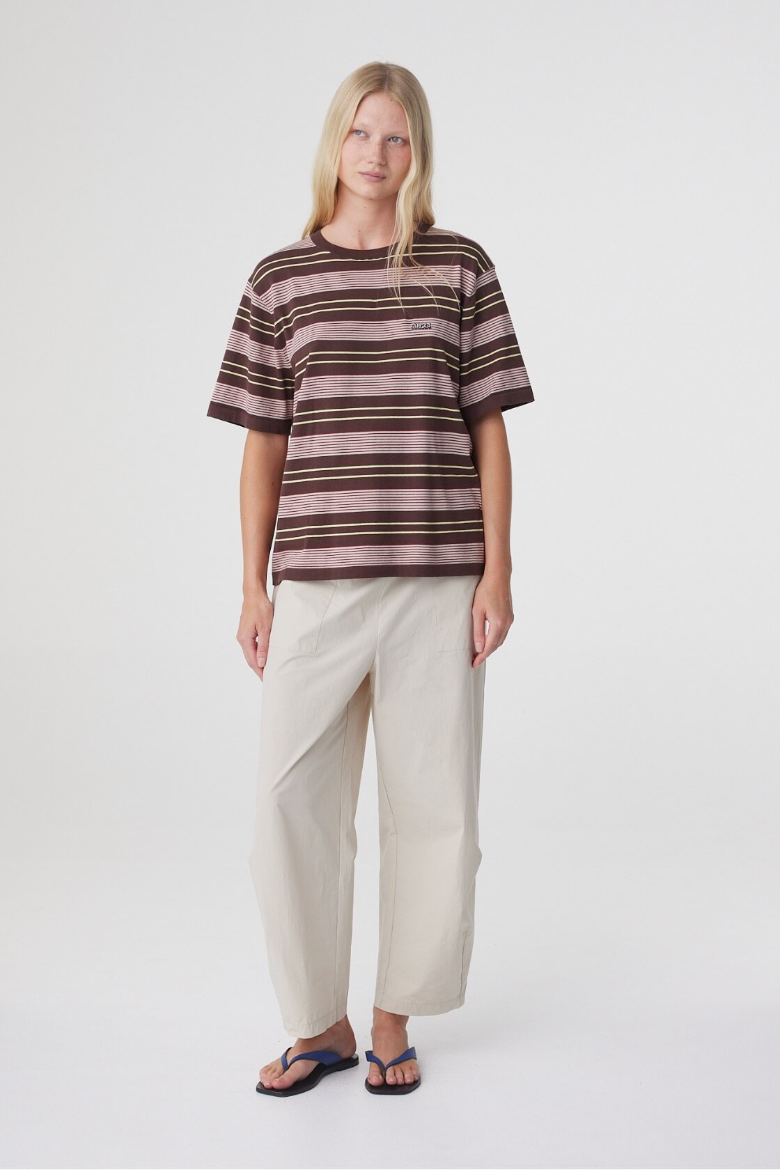 Lena Barrel Pant in Taupe, full front view styled with a striped oversized tee and flat sandals.