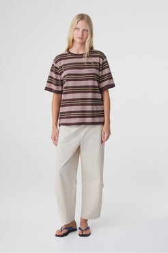 Lena Barrel Pant in Taupe, full front view styled with a striped oversized tee and flat sandals.