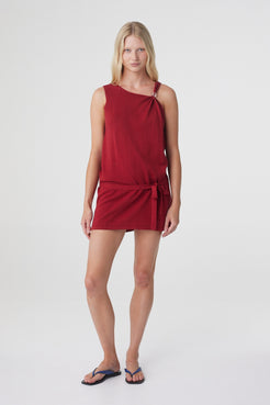 Clara Mini Dress in Chilli, full front three quarter view showing the low waist tie and mini length.