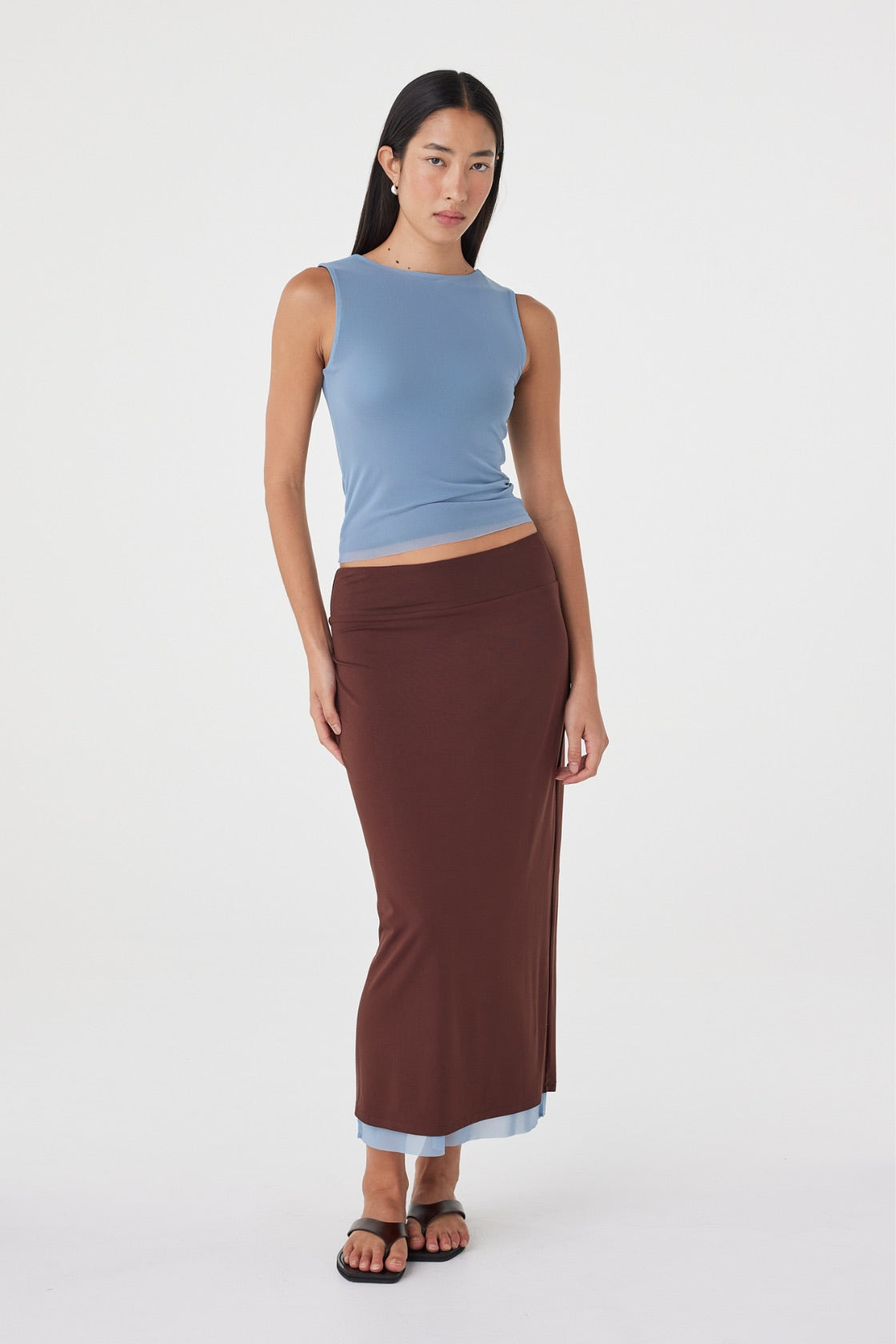 Angled front view of the Eden Reversible Skirt in Pale Blue & Espresso showcasing the espresso reverse side, slim silhouette and matching pale blue top.
