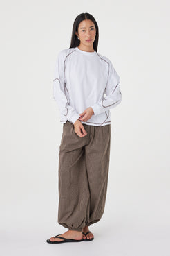Full-length front view of the Kesh LS Tee in Cream & Espresso showcasing the relaxed fit, long sleeves and contrast stitching