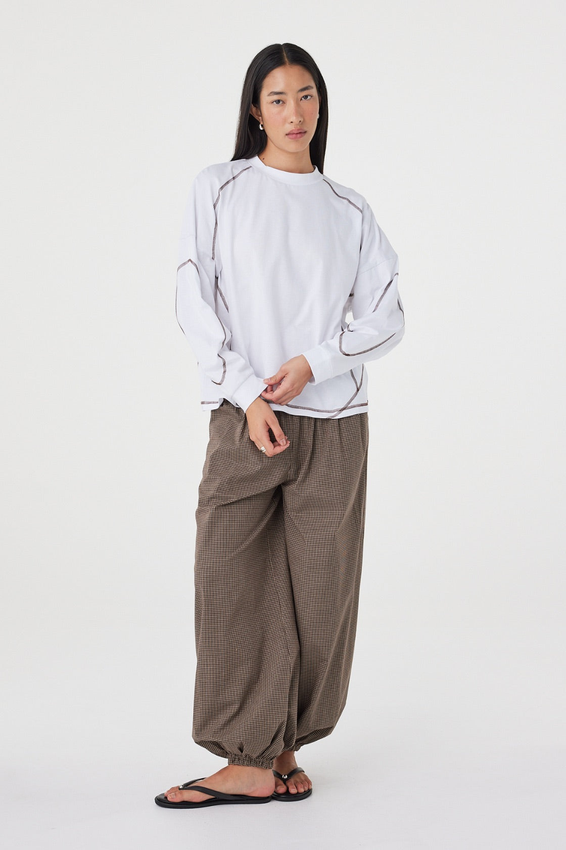 Full-length front view of the Kesh LS Tee in Cream & Espresso showcasing the relaxed fit, long sleeves and contrast stitching