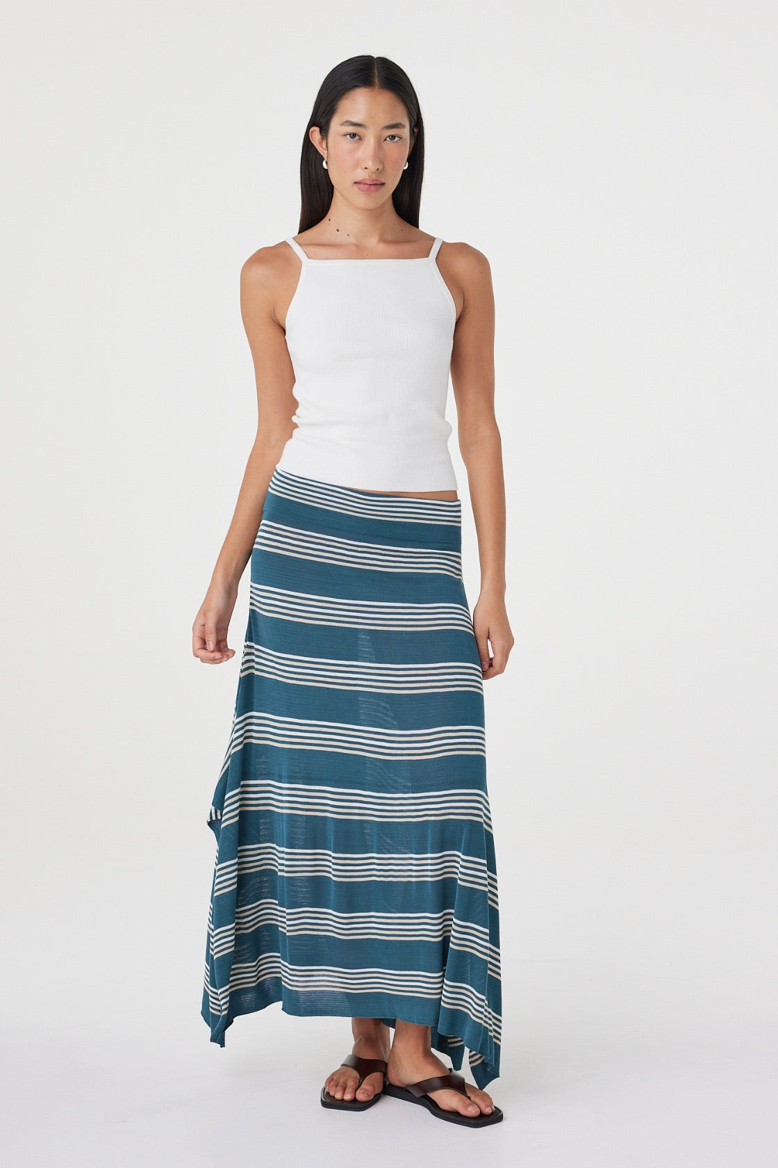 Full-length front view of the Lex Skirt in Teal Stripe showcasing the asymmetric hemline, soft bamboo blend knit and fluid drape.