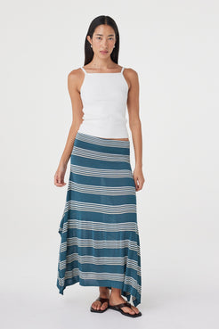 Full-length front view of the Lex Skirt in Teal Stripe showcasing the asymmetric hemline, soft bamboo blend knit and fluid drape.