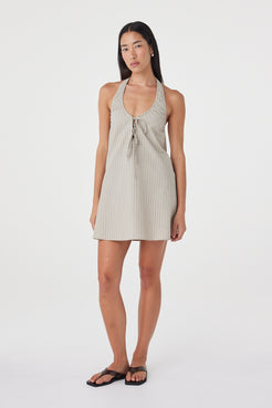 Three-quarter front view of the Joni Mini Dress in Taupe Stripe featuring the subtle stripe pattern, double tie front and easy mini silhouette.
