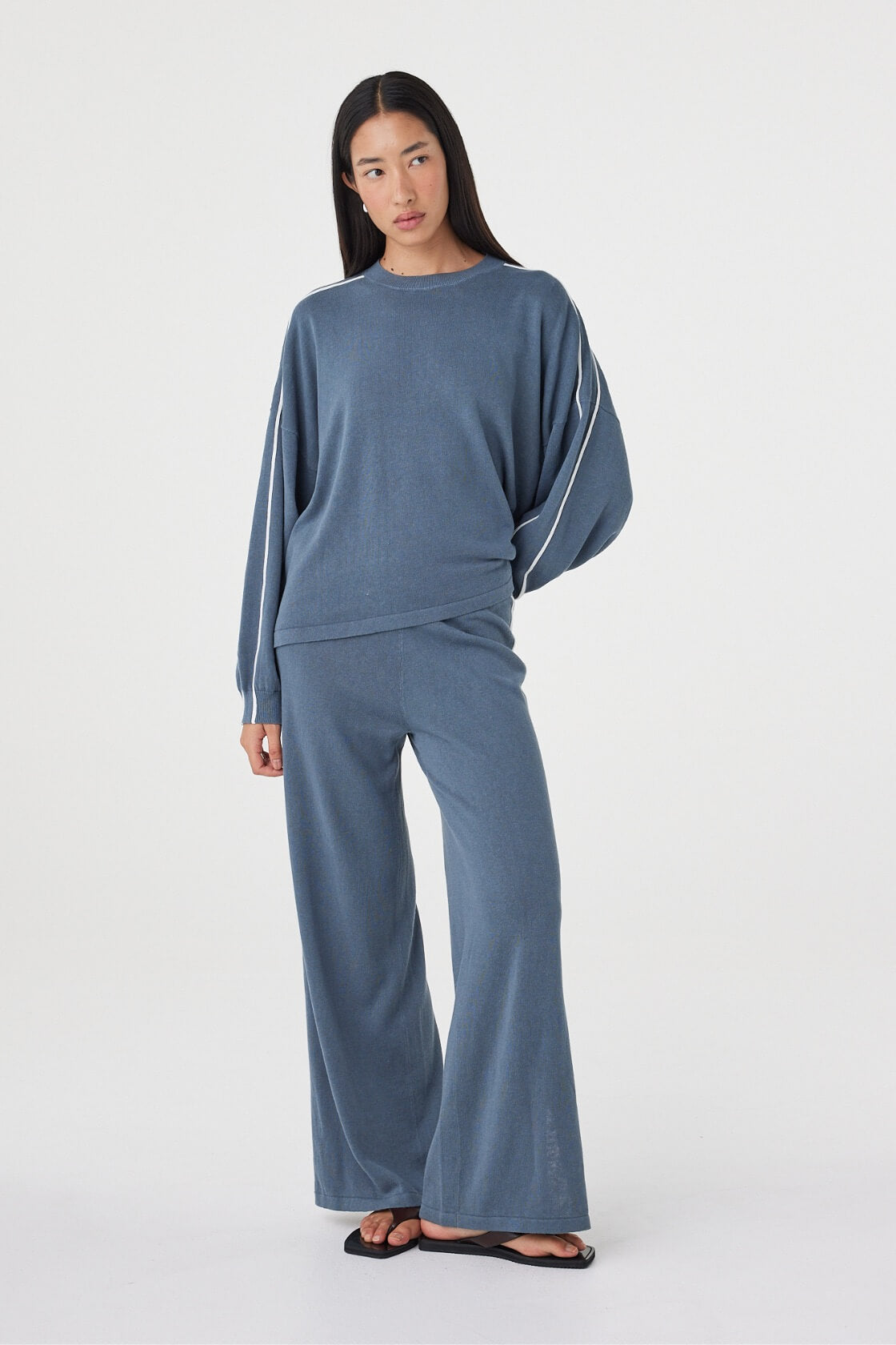 Angled front view of the Pippa Pant 2.0 in Storm & Cream styled with the matching Pippa Longsleeve Tee, highlighting the effortless relaxed fit and coordinated set.