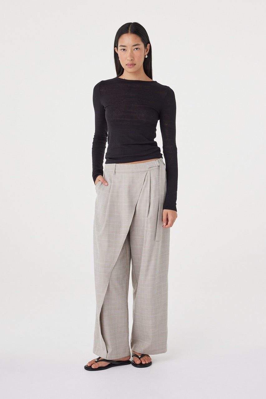 Full-length view of the  Calla Pant in Taupe Plaid styled with the Aston LS in Black and flat sandals.