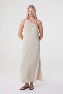 Clara Maxi Dress in Taupe, three quarter front view showing the side seam split and movement through the hem.