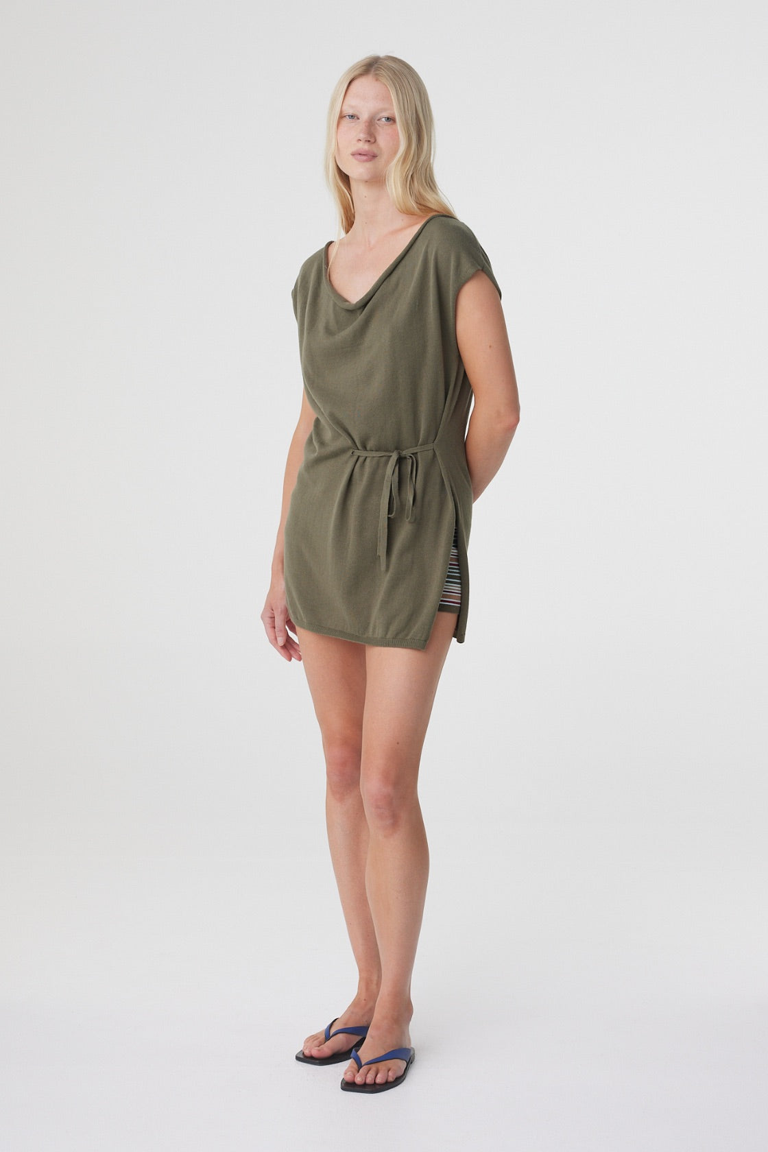 Nora Top in Smokey Olive, full length angled view showing the adjustable waist tie and soft drape through the body.