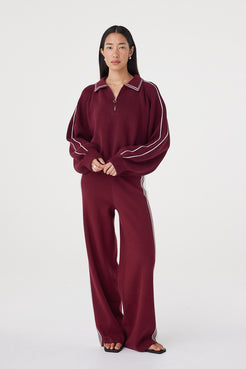 Emery Pant in merlot styled with the coordinating zip-front top, featuring a sporty side stripe, soft structure and relaxed proportions