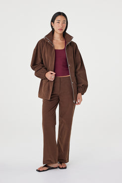 Amari Jacket in espresso worn open over a merlot tank with matching tailored pants and black sandals, highlighting the relaxed layering fit and soft texture