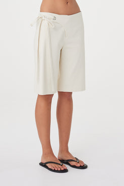 Angled close view of the Lucia Tie Bermuda Short in Bone highlighting the soft cotton Tencel fabrication, double waist ties and relaxed leg.
