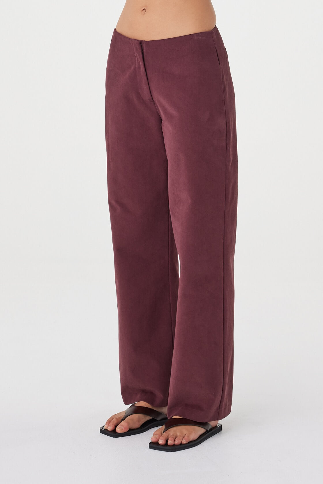 Side view of the Avery Pant in Merlot highlighting the relaxed leg shape and fluid drape.