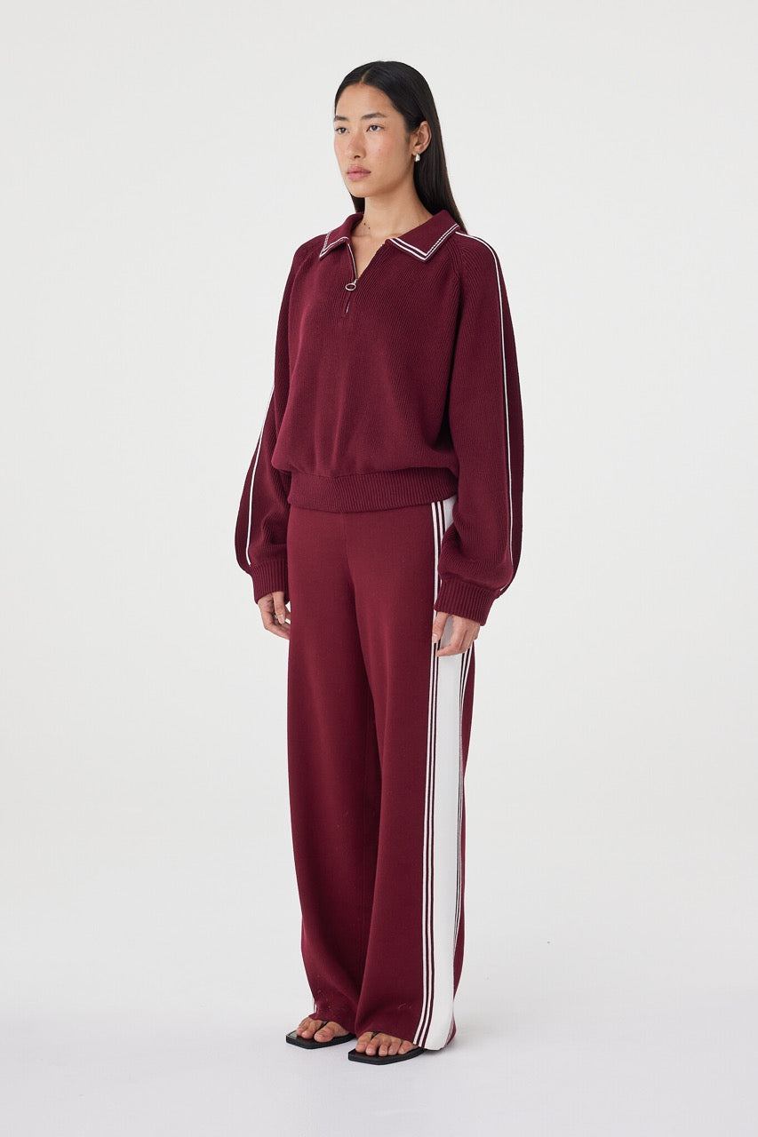 Emery Pant in merlot and cream worn with an oversized matching top and black sandals, showcasing the comfortable high-rise fit and fluid straight-leg silhouette