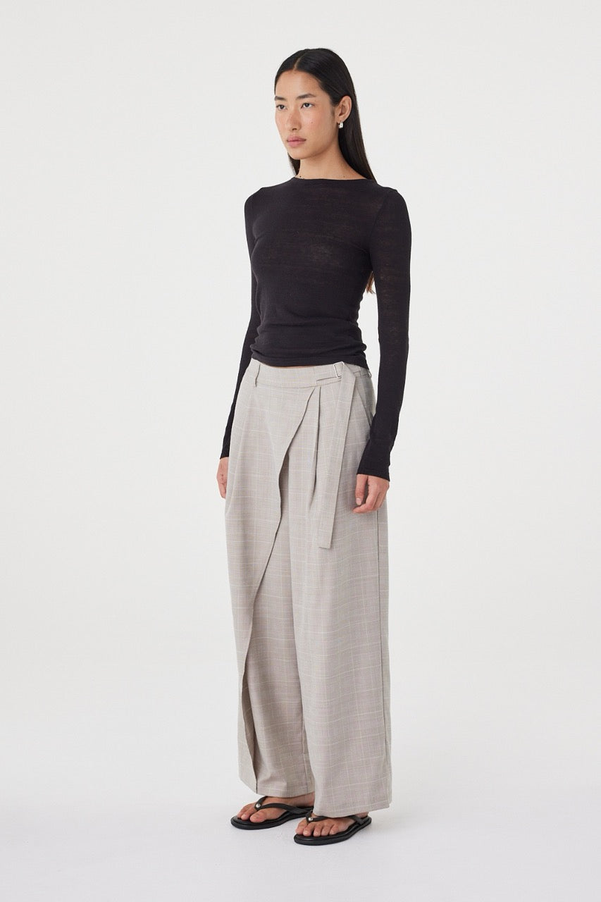 Angled side view of the  Calla Pant in Taupe Plaid highlighting the wrap-front detail and soft drape through the leg.