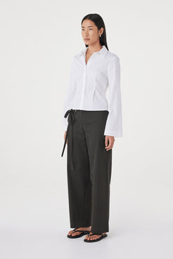 Side view of the Ari Shirt in  White showing the fitted silhouette, princess seam detailing and lightweight cotton construction.