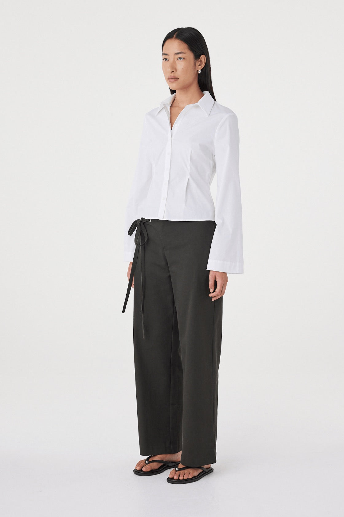 Side view of the Ari Shirt in  White showing the fitted silhouette, princess seam detailing and lightweight cotton construction.