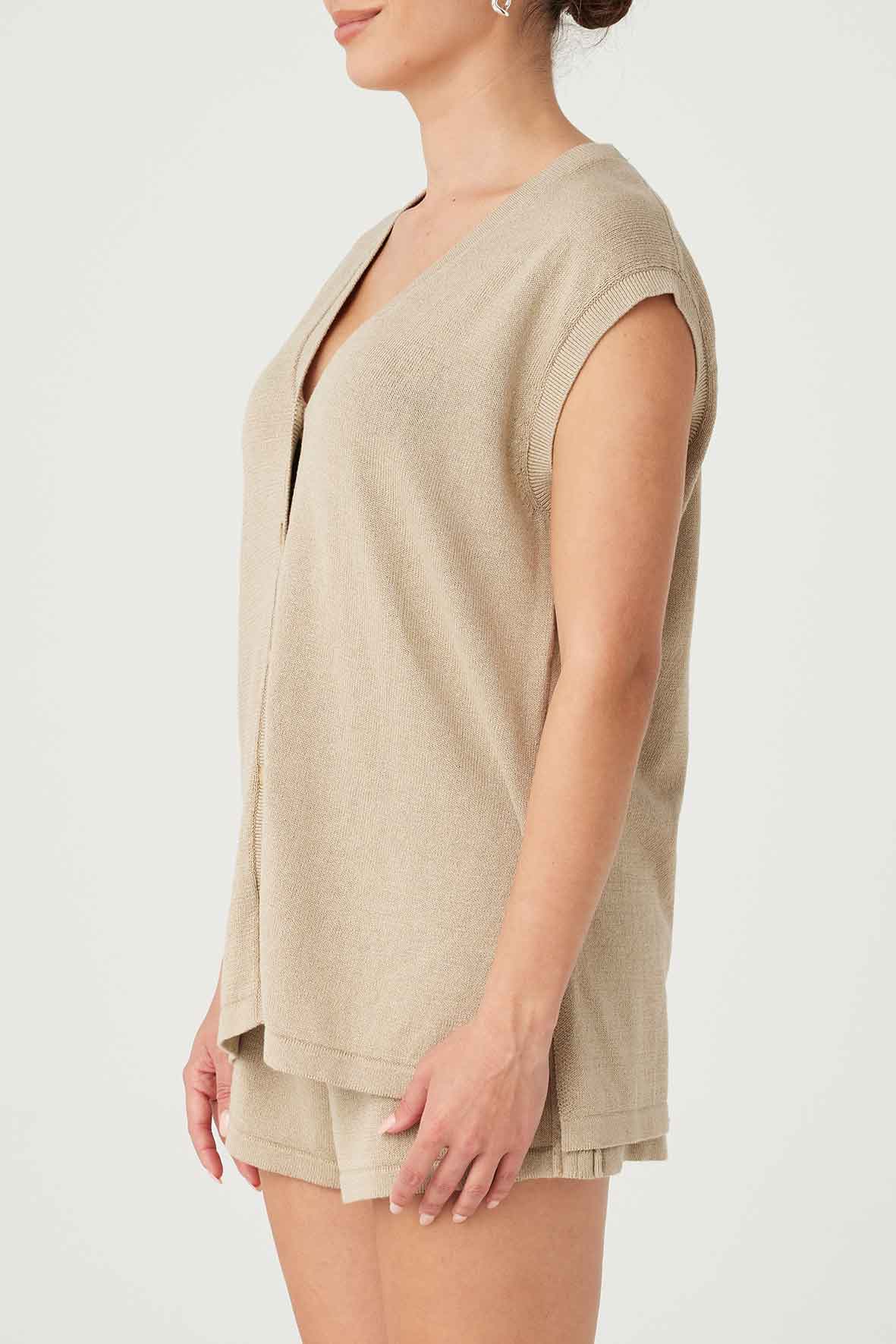 Side view of Ada Vest in taupe, showcasing relaxed fit and side splits, crafted from OEKO-TEX certified organic cotton and linen.