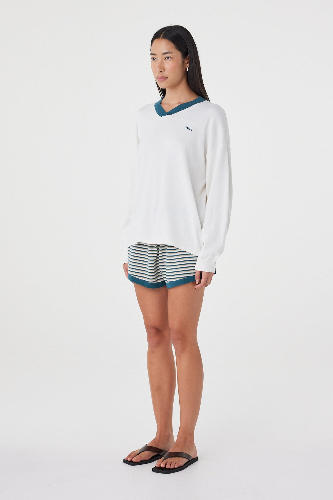 Side view of the Cammy LS Tee in Cream & Teal showing the extra oversized silhouette, relaxed long sleeves and contrast ribbed neckline.