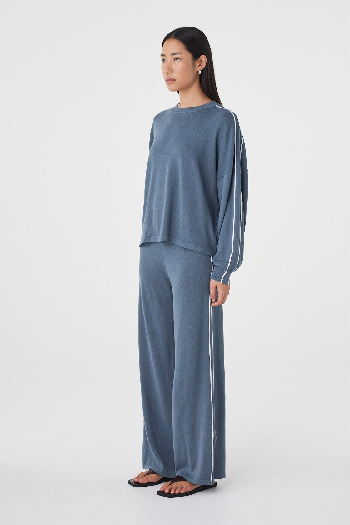 Side view of the Pippa Pant 2.0 in Storm & Cream highlighting the relaxed silhouette, lightweight fabrication and fluid wide-leg shape.