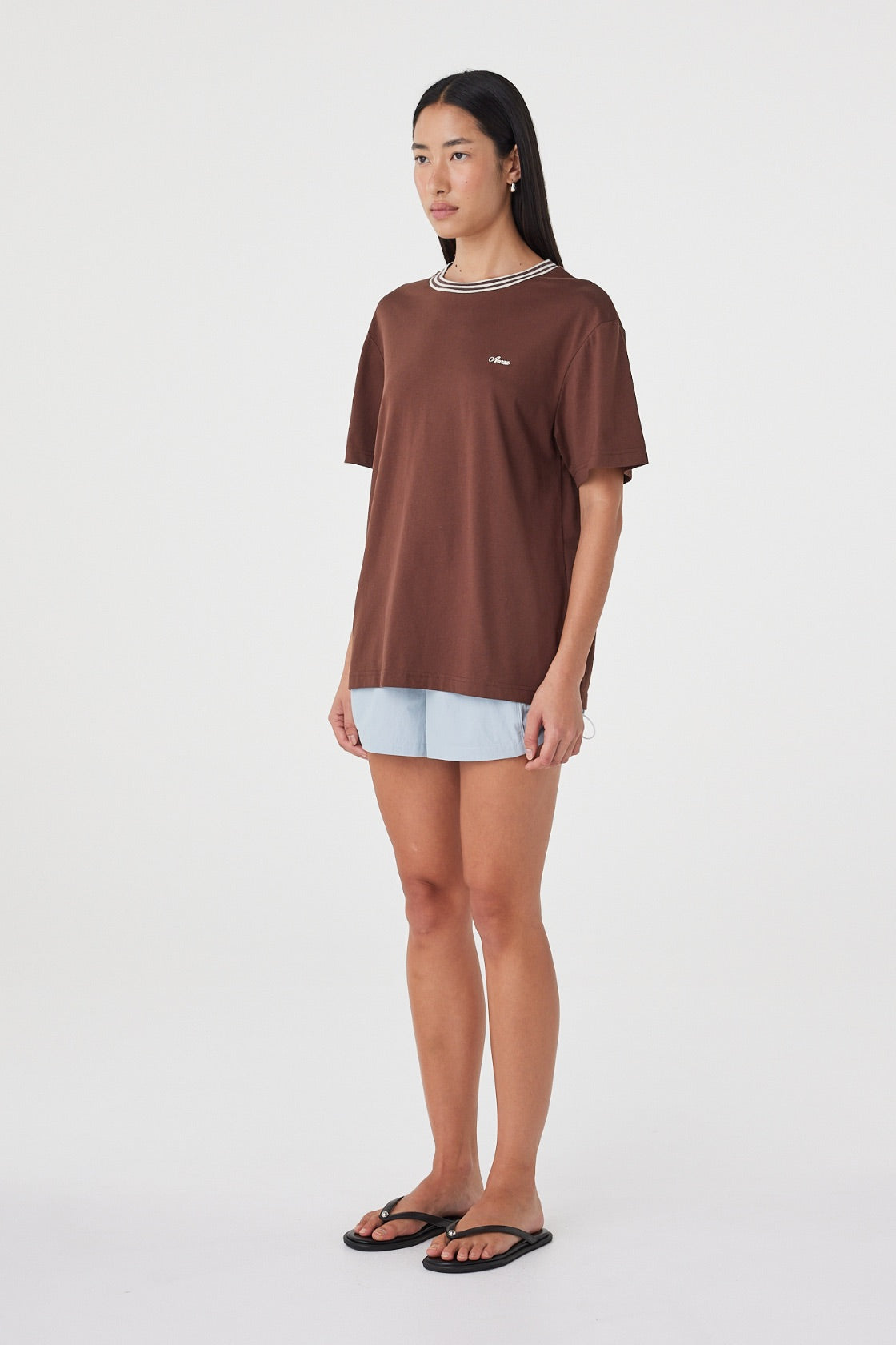 Kylen Tee in Espresso & Cream three-quarter view showing the oversized silhouette, dropped shape through the shoulders and contrast collar.