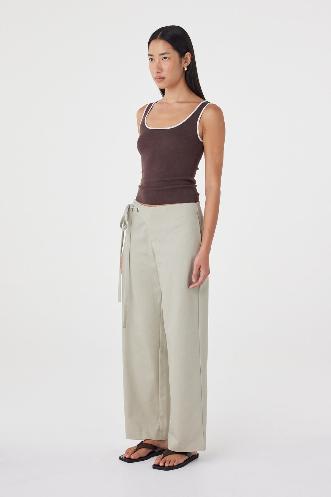 Side view of the Kaya Tank in Espresso &Cream featuring the close-fitting silhouette, contrast armhole detailing and lightweight knit fabrication.
