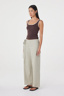 Side view of the Kaya Tank in Espresso &Cream featuring the close-fitting silhouette, contrast armhole detailing and lightweight knit fabrication.