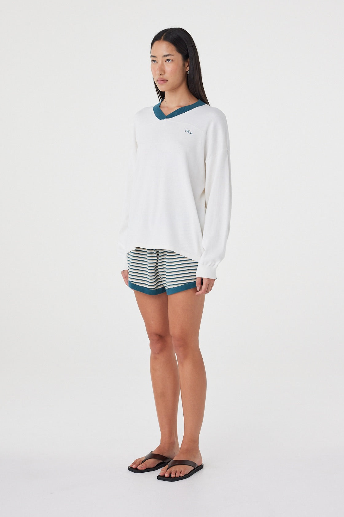 Angled full-length view of the Netta Shorts in Teal Cream Stripe paired with the Cammy LS Tee, showing the side stripe detailing and easy fit.