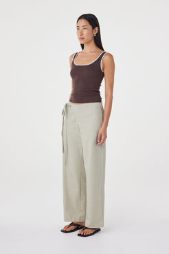 Side view of the Lucia Tie Pant in Light Sage highlighting the relaxed straight-leg silhouette, functional side seam pockets and effortless drape.