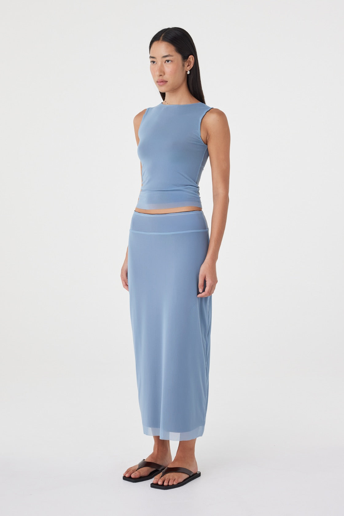 Side view of the Eden Reversible Skirt in Pale Blue & Espresso highlighting the longline fit, smooth drape and reversible construction.