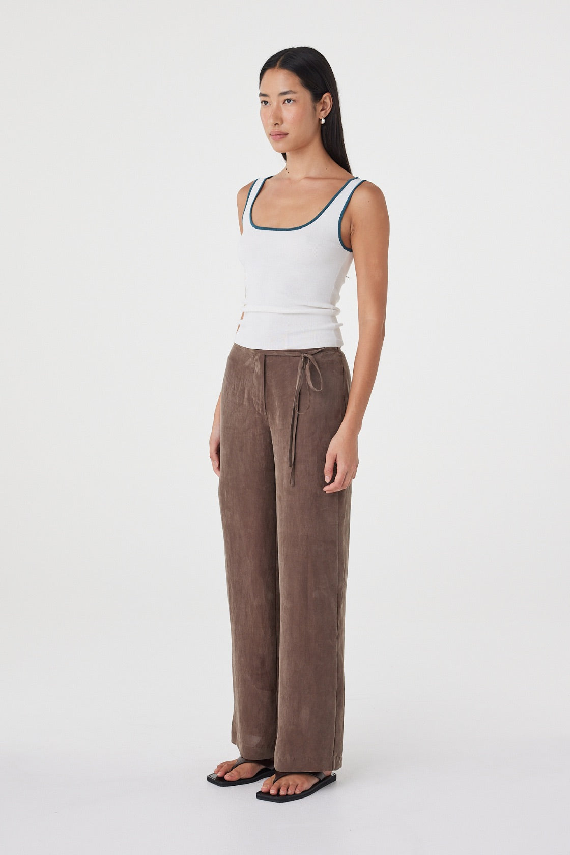 Angled full-length view of the Maisie Tie Pant in Espresso showing the fluid drape and relaxed fit through the hip and leg.
