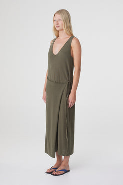Sarina Wrap Maxi Dress in Smokey Olive, three quarter view showing the drape of the linen cotton fabric and wrap detail at the waist.