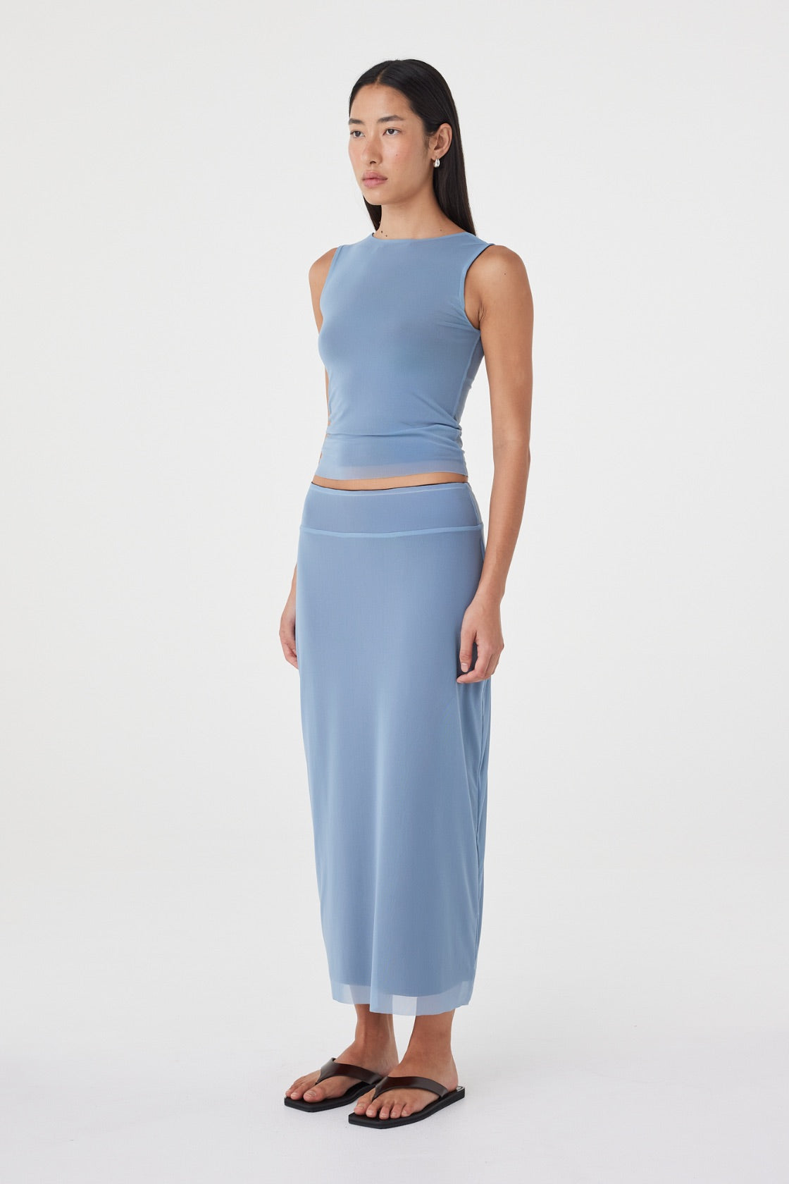 Side view of the Eden Reversible Top in Pale Blue & Espresso featuring the slim fit, reversible construction and soft stretch fabrication.