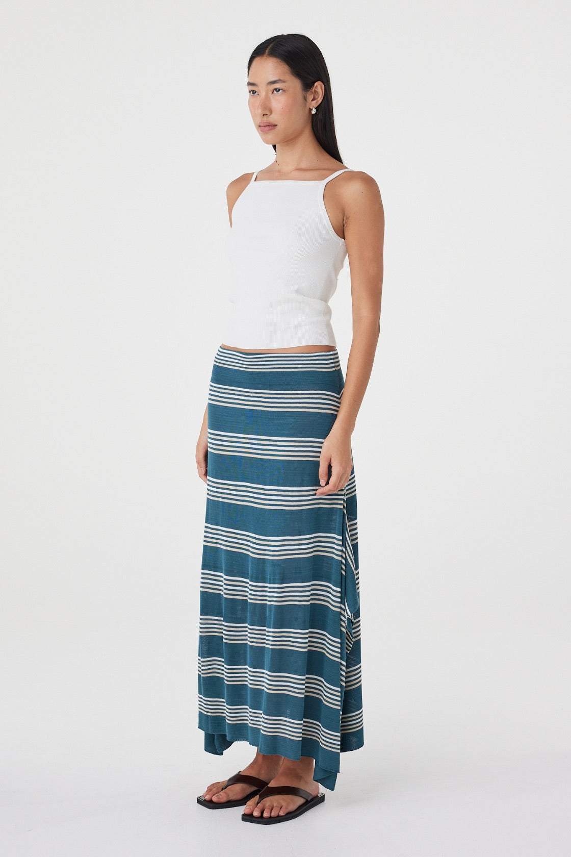 Angled view of the Lex Skirt in Teal Stripe highlighting the custom horizontal stripe pattern and flowing handkerchief silhouette.