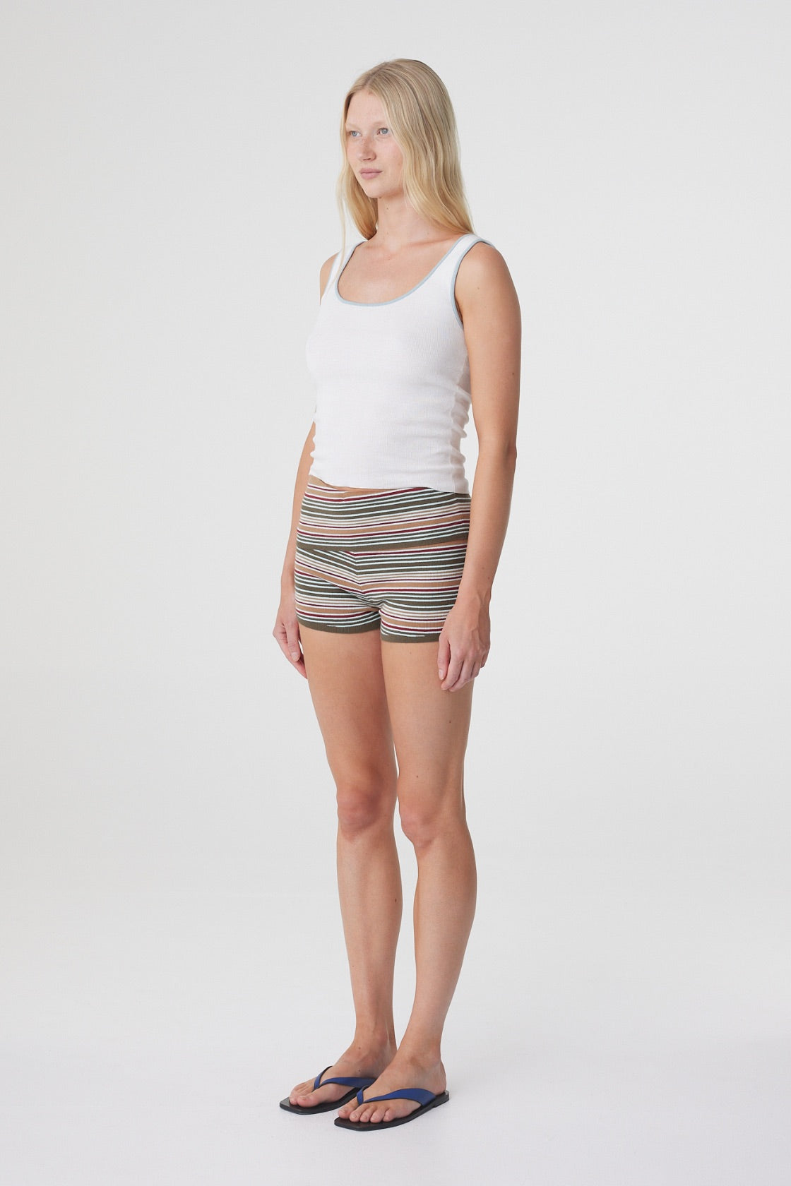 Kaya Tank in Cream & Dusk Blue, three quarter view highlighting the fitted shape and scoop neckline.
