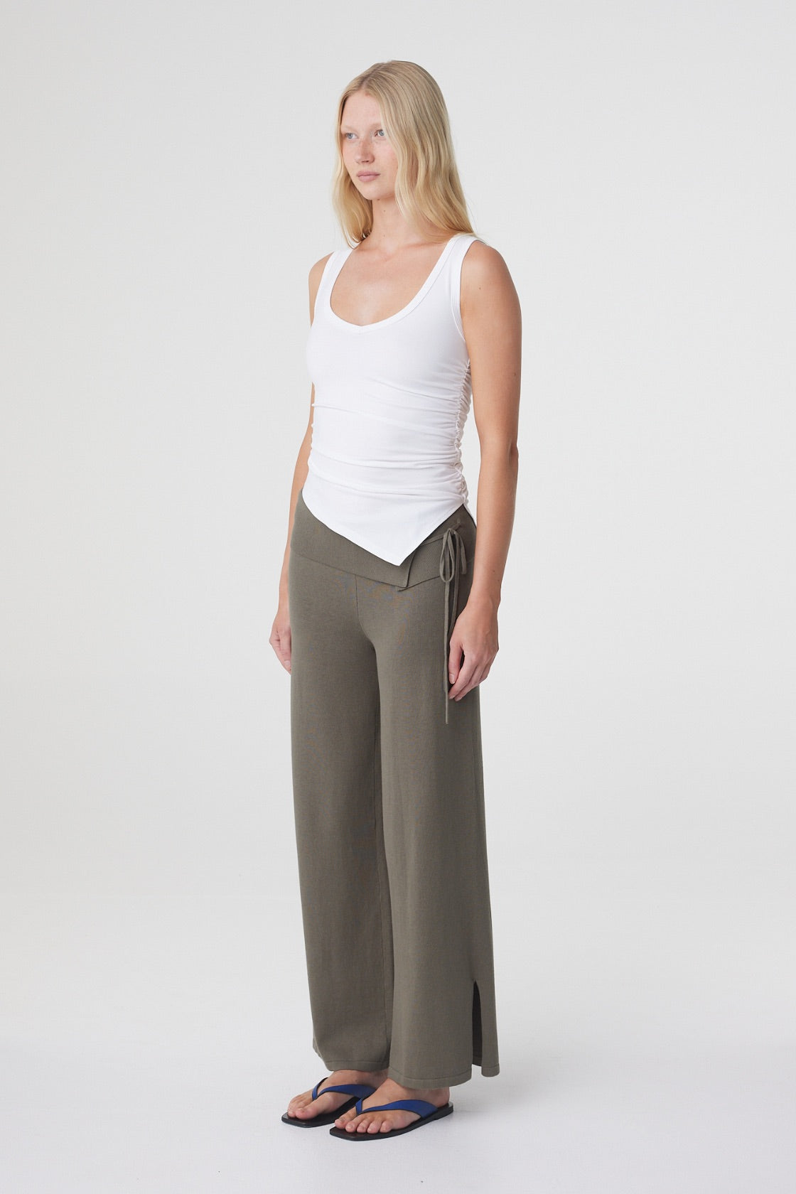 Elin Tank in Cream, three quarter view showing the ruched side seam, small side split and angled hem.