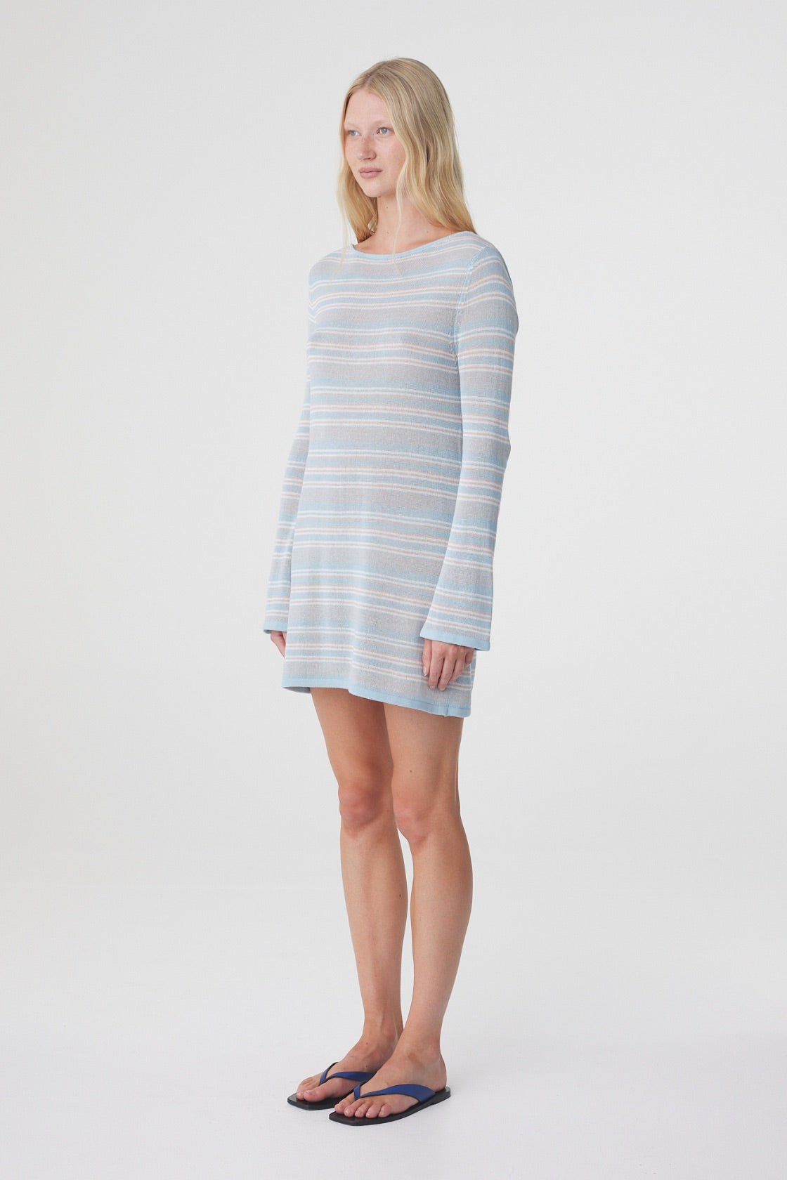 Nia Long Sleeve Mini Dress in Dusk Blue Cream Stripe, three quarter view showing the relaxed fit, mini length and subtle sheerness of the knit.