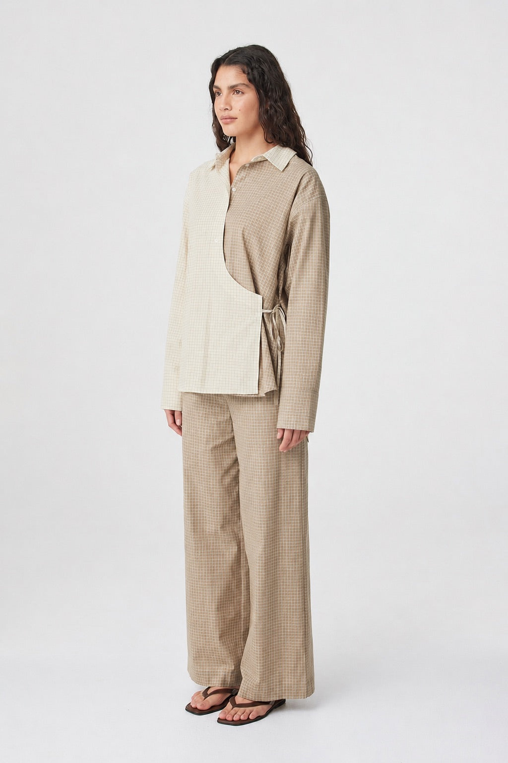 Autumn Wrap Shirt in Two Tone Check styled with coordinating check pants, full-length 3/4 view showing the oversized fit and curved hem.