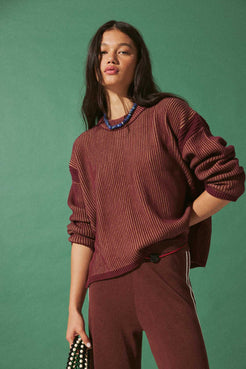 Model wearing Merlot & Pecan two-tone rib knit sweater in oversized slouchy fit, cropped length over matching pants for cool evenings