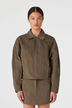 Front view of khaki velvet-finish cotton jacket showing concealed zip closure and cropped hem