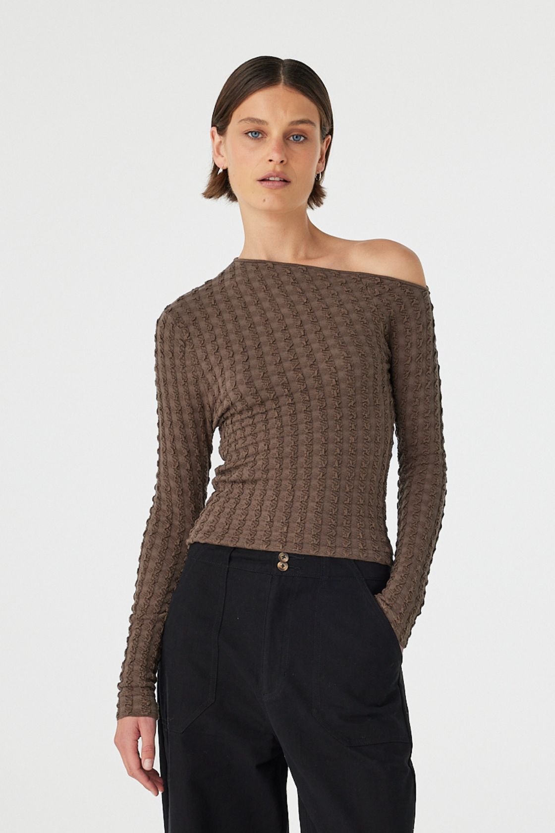 Sedona long sleeve top in Pavement with asymmetrical neckline and textured knit, styled with black pants