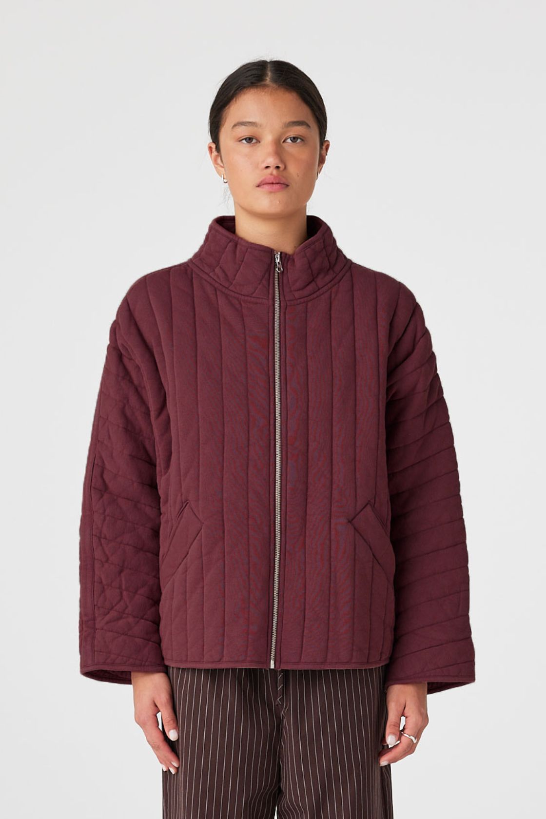 Merlot quilted zip jacket layered over tank top for air-conditioned spaces and travel
