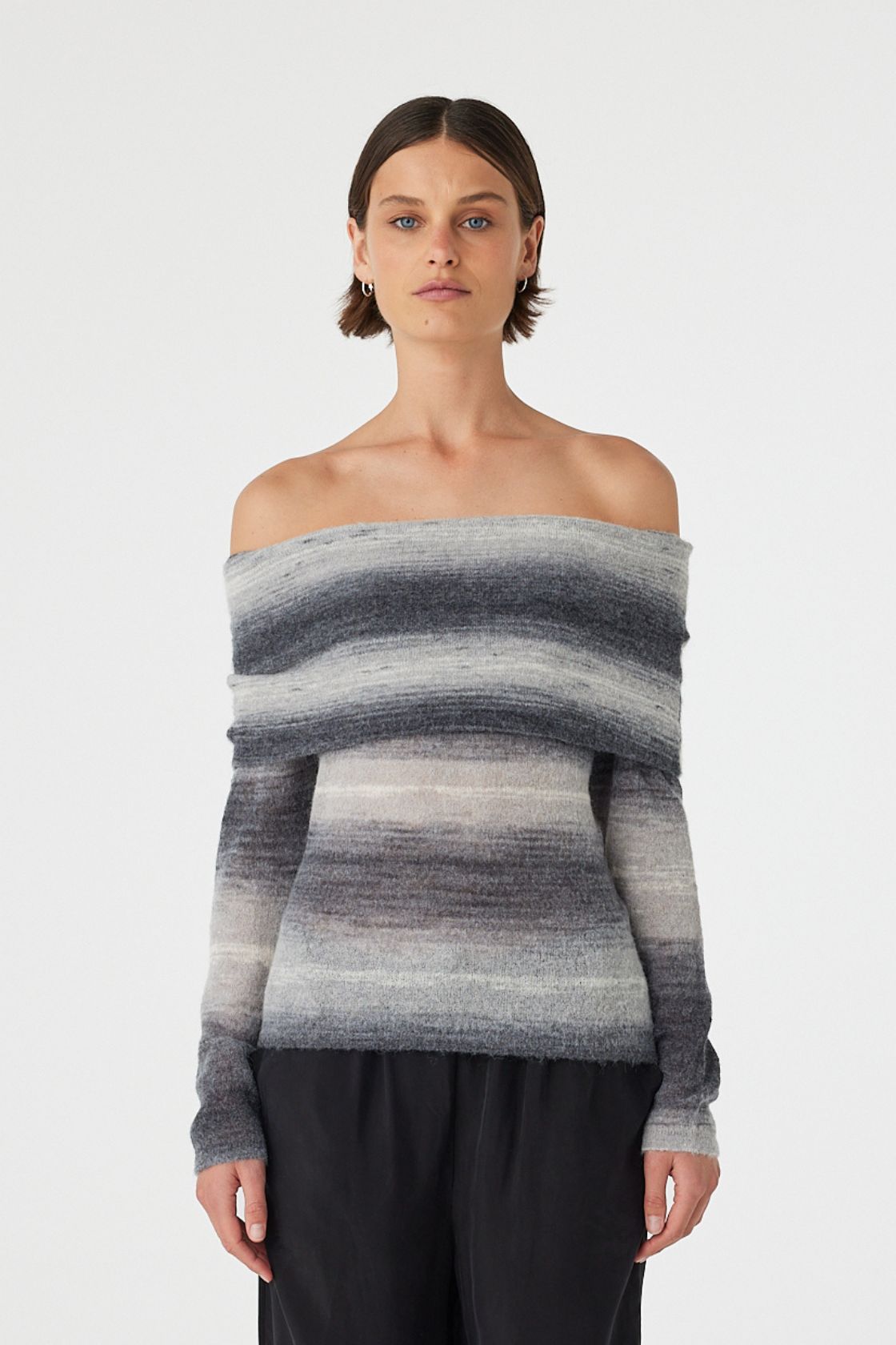 Nikki off the shoulder top in grey and cream ombre knit featuring a soft foldover neckline and fitted silhouette, styled with relaxed black wide leg pants