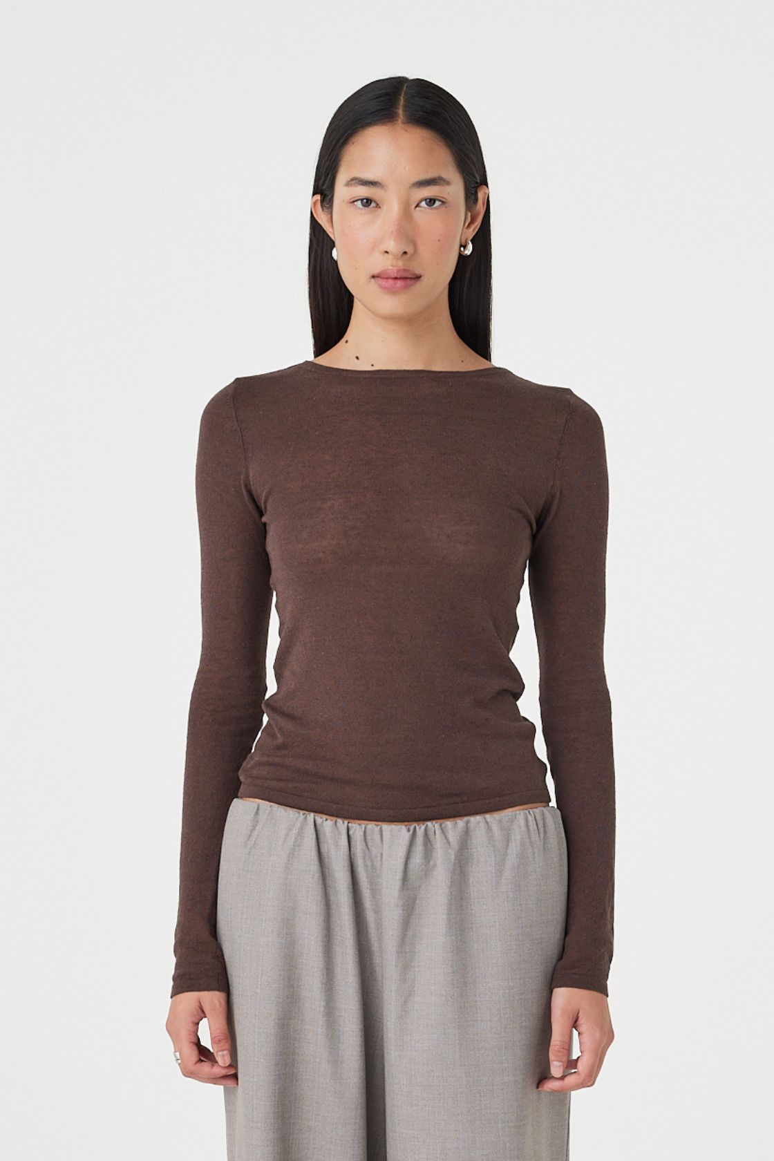 Full-length front view of the Aston LS Top in espresso showcasing the long sleeve silhouette, soft semi-sheer finish and clean boat neckline styling