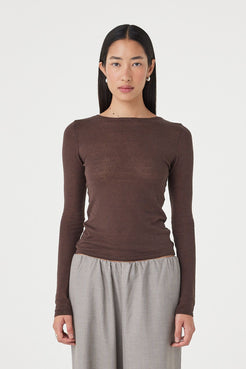 Full-length front view of the Aston LS Top in espresso showcasing the long sleeve silhouette, soft semi-sheer finish and clean boat neckline styling